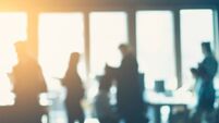 unrecognizable motion blurred business people in an office