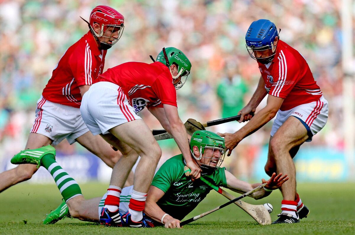 Cork's Lorcán McLoughlin, Tom Kenny and Daniel Kearney tackle Seamus Hickey of Limerick during the 2013 Munster hurling final. Picture: ©INPHO/James Crombie Cork's Lorcán McLoughlin, Tom Kenny and Daniel Kearney tackle Seamus Hickey of Limerick during the 2013 Munster hurling final. Picture: ©INPHO/James Crombie