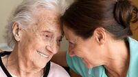 Dementia and Occupational Therapy - Home caregiver and senior adult woman