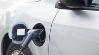 Electric car plugged in charging
