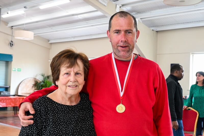 Phil Goodman with RehabCare's David Hogan at the annual Young at Heart kurling competition. 