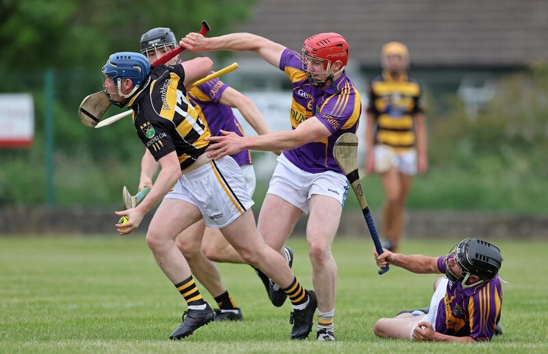  Jamie Magner of Avondhu tries to get away from David Curtin, Tim Twohig and Jack O'Callaghan of Carbery. Picture: Jim Coughlan