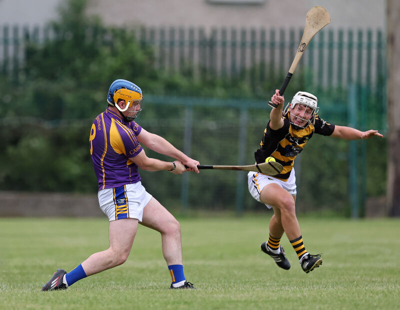  Luke Carey of Avondhu attempts to block down the shot of Conor O'Sullivan of Carbery. Picture: Jim Coughlan