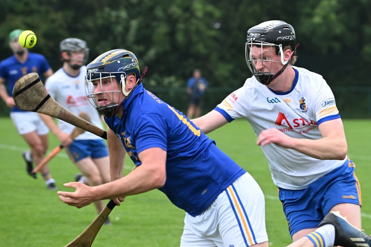 St Finbarr’s Scott Callanan gets his handless away under pressure from Carrigaline's Patrick Mellett. Picture Chani Anderson