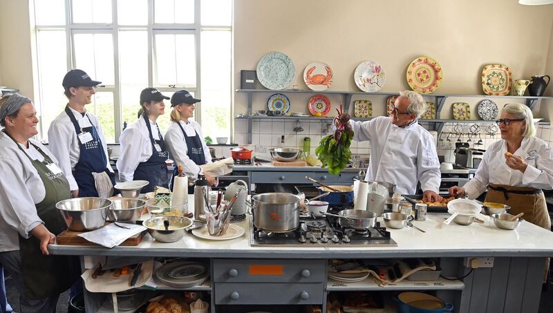 Darina Allen and Rory O'Connell in one of the kitchens at Ballymaloe Cookery School with students taking part in the 12 weeks certificate course. Picture Denis Minihane.