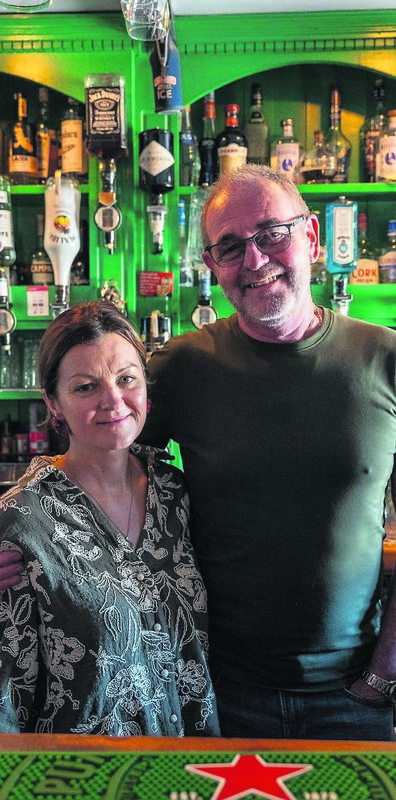 Monika and Mike Murphy behind the bar at Poc Ar Buile (The Mad Puck Goat) in Ballinrostig, East Cork. “You’d want to be doing it for love,” he said of his job. Monika and Mike Murphy behind the bar at Poc Ar Buile (The Mad Puck Goat) in Ballinrostig, East Cork. “You’d want to be doing it for love,” he said of his job.