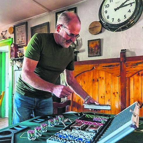 Proprietor Mike Murphy setting up the poker tables at his pub