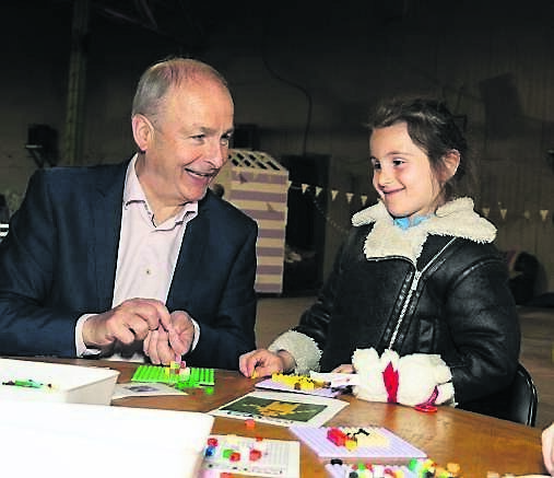 An Taoiseach Micheál Martin with Ellie May from Blackpool at the Fun Inclusive Youth Space in the Marina Market for Cruinniu na nÓg.