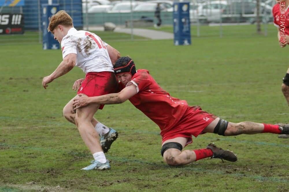 Séadna Forrest makes a tackle during the international U18 match against Poland. Séadna Forrest makes a tackle during the international U18 match against Poland.