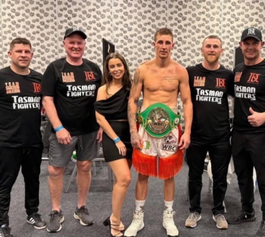 Danny Keating with his partner Zoe and management team after winning the WBC Australian Welterweight title.