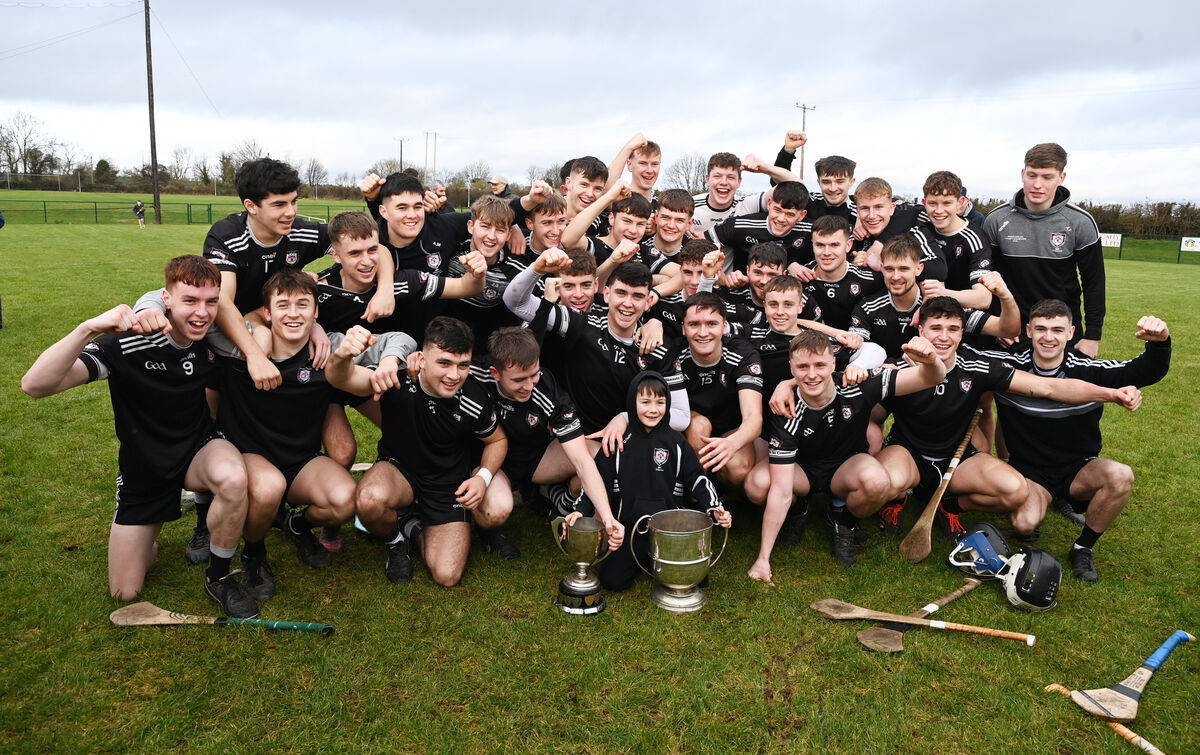 Midleton players celebrate after defeating Bride Rovers and securing both U21 titles last year. Darragh McCarthy is in the front row, second from the right, wearing the no 10 jersey. Picture: Eddie O'Hare