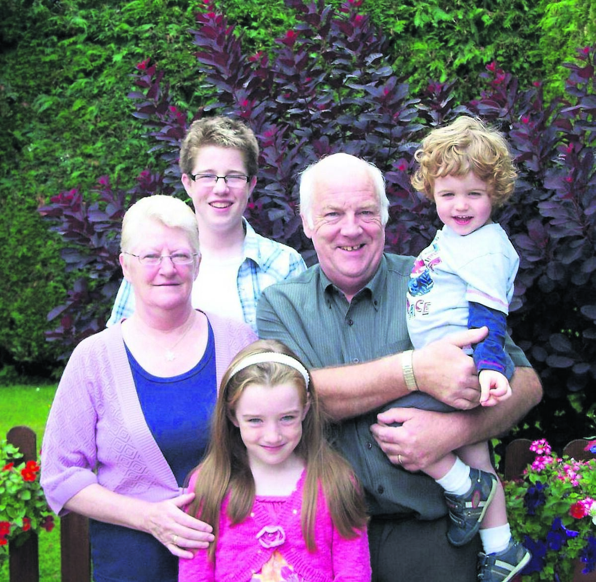 Orla Barry as a child (front) with her siblings Cian and Rúairí Barry and grandparents Etta and Dave Byrne. The death of Orla’s granny led her to pursue a career as an embalmer. “I ended up putting my nana’s glasses on her, and in that moment, she looked like herself again,” recalls Orla