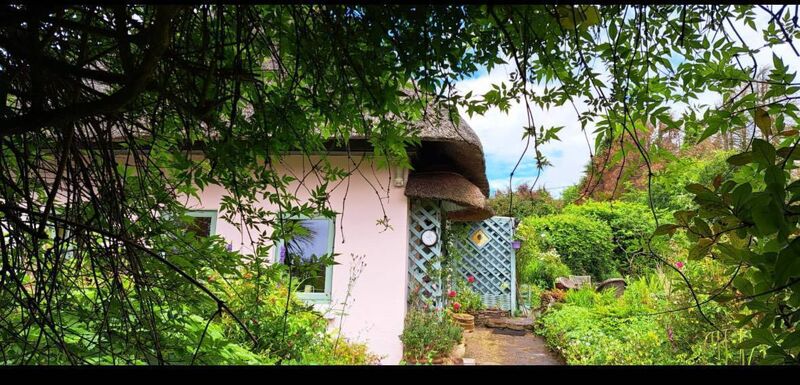 Margaret Adams' beautiful thatched home in Killeagh before the fire.