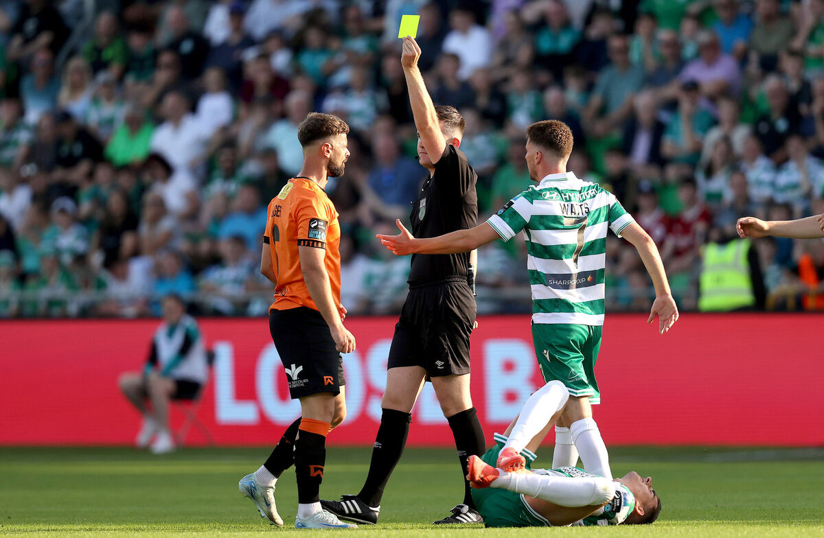 Cork City's Greg Bolger is shown a yellow card by referee Aaron O’Dowd. Picture: INPHO/Bryan Keane