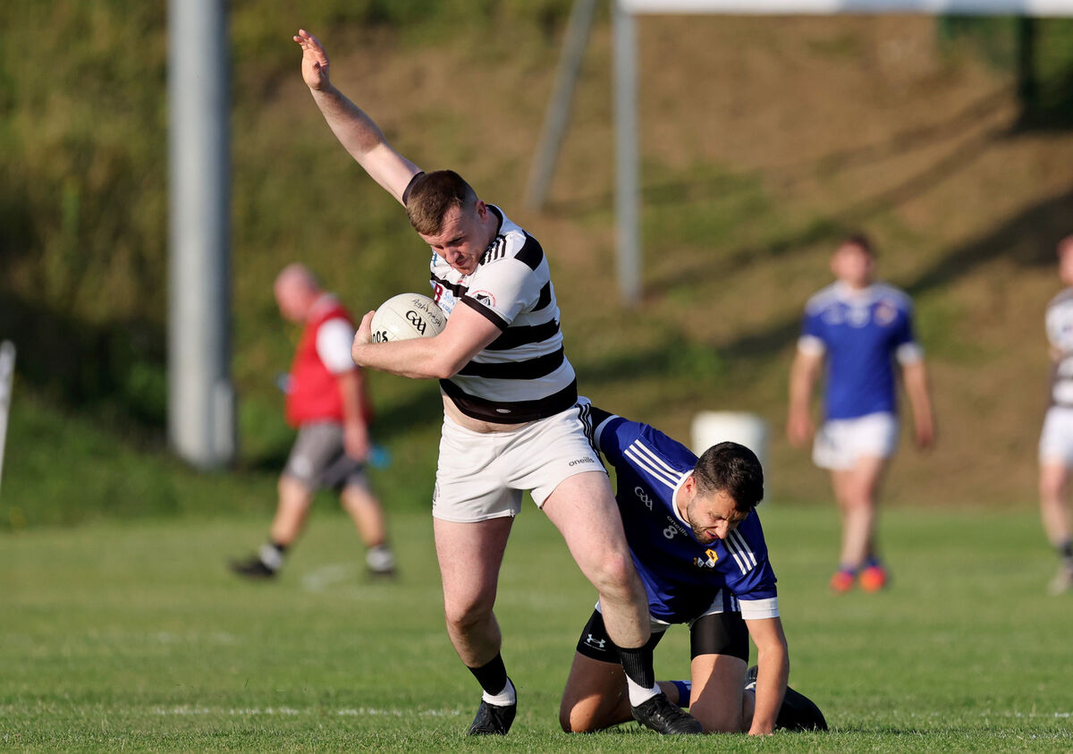  Ken McCarthy Coade, St.Nick's gets away from Matthew McCarthy, Aghinagh. Picture: Jim Coughlan.