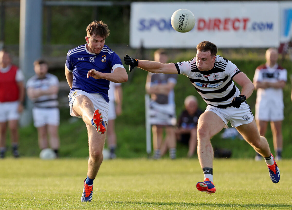  Sean Horgan, St.Nicks tries to tackle Con Buckley, Aghinagh. Picture: Jim Coughlan.