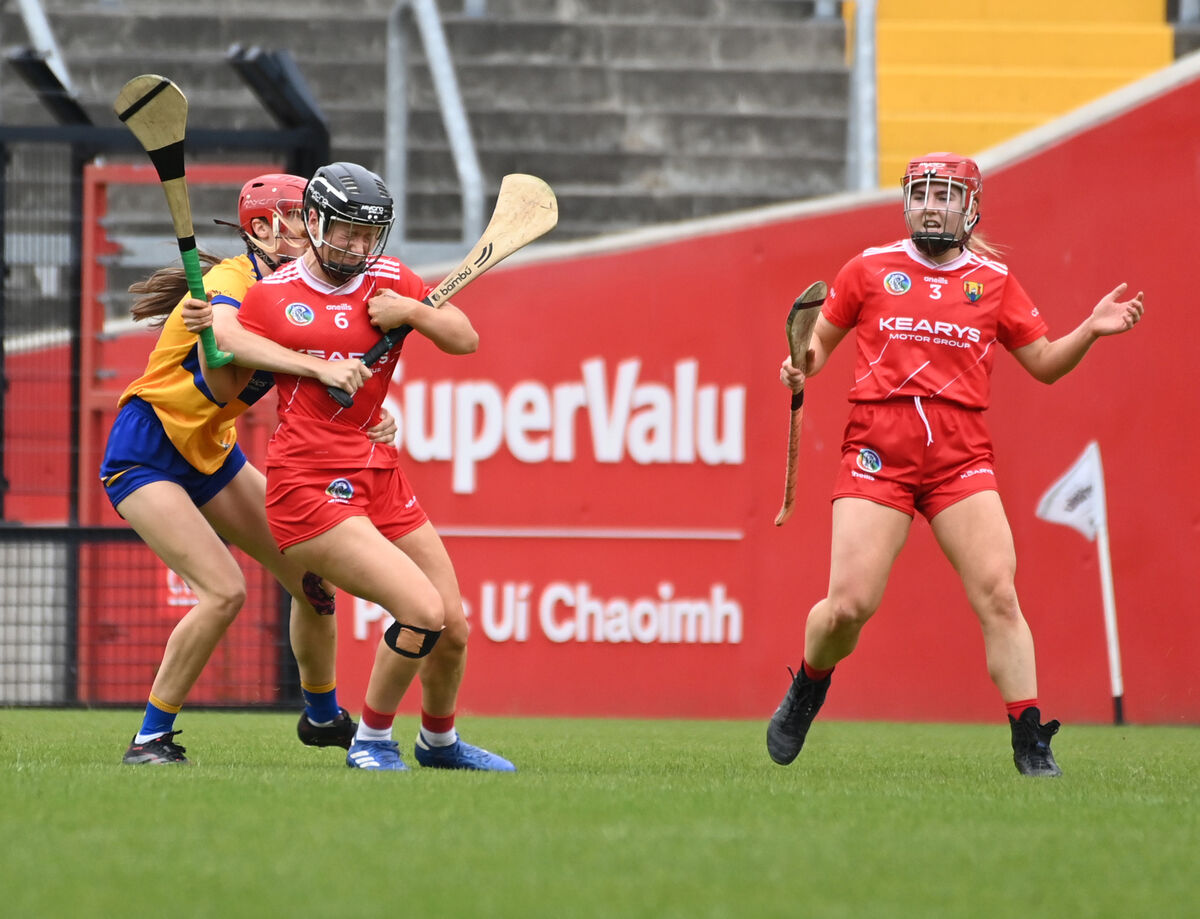 Cork's Laura Treacy is held by Clare's Jennifer Daly watched by Libby Coppinger. Picture: Eddie O'Hare