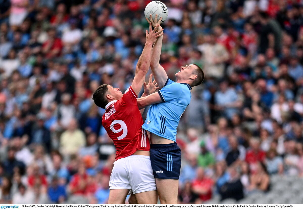 Cork's Colm O'Callaghan and Peadar Ó Cofaigh Byrne of Dublin battle for the ball. Picture: Ramsey Cardy/Sportsfile
