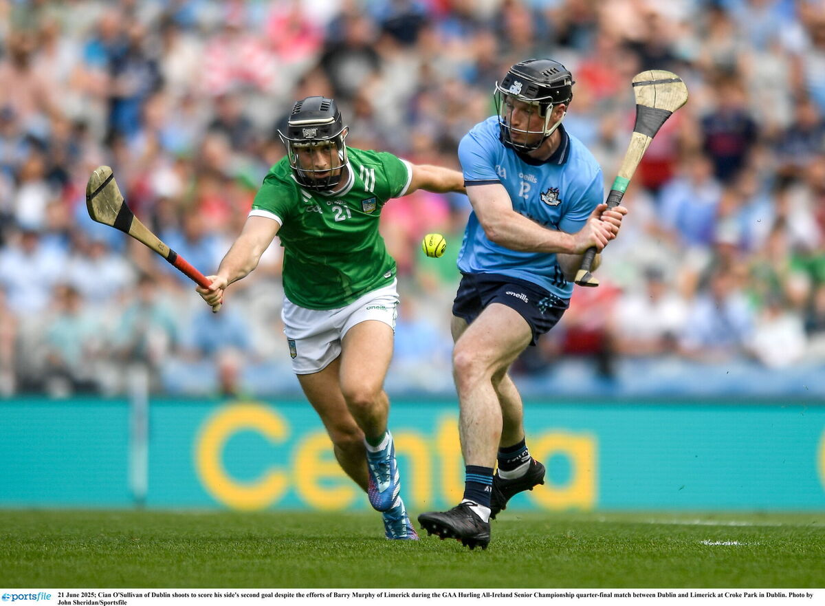 Cian O'Sullivan of Dublin shoots to score his side's second goal despite the efforts of Barry Murphy of Limerick. Picture: John Sheridan/Sportsfile