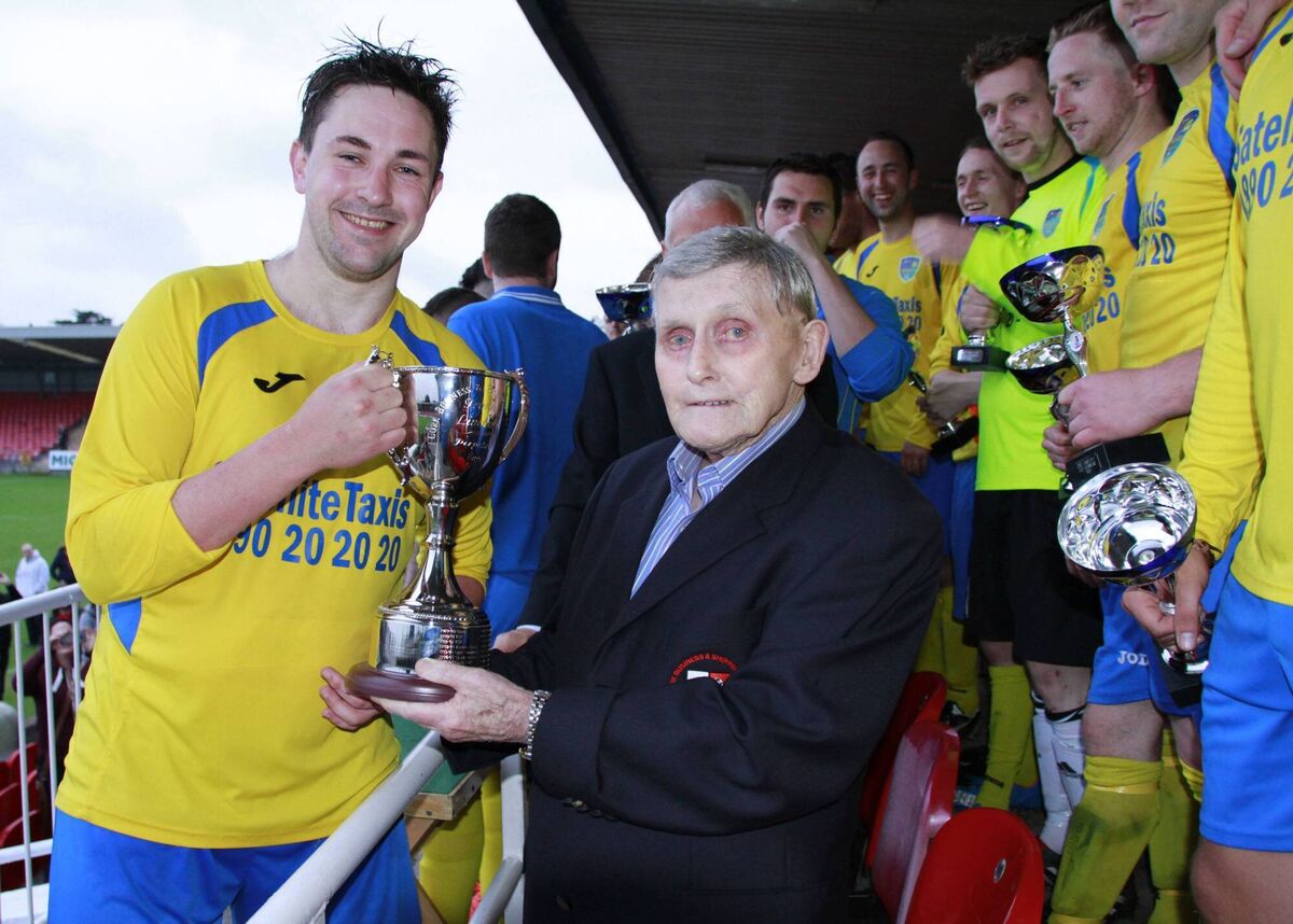 Former CBSL treasurer and PRO Frank Linehan presents the trophy named in his honour to victorious Satellite Taxis' captain Kevin O'Connor in 2016. PIcture: Finbarr Buckley