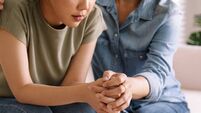 Middle aged asia people old mom holding hands trust comfort help young woman talk crying stress relief at home. Mum as friend lo