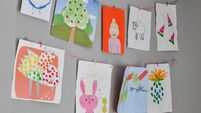 Child drawings hanging on the wall, preschool child painting, kids room, Children's creativity, empty space