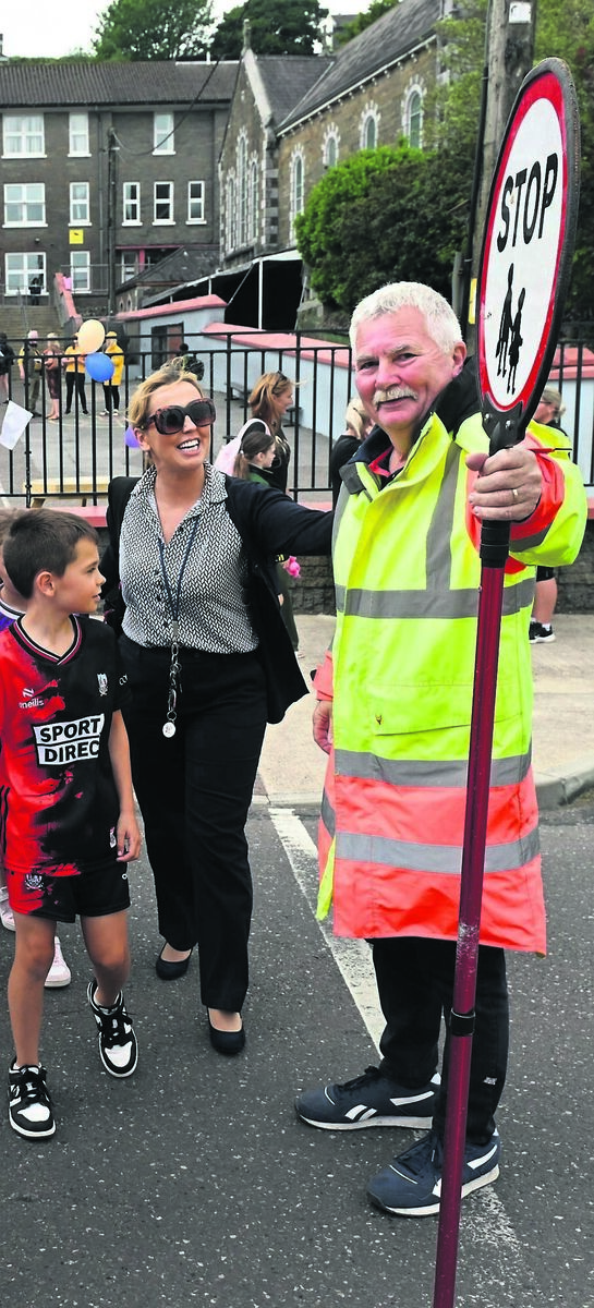 Lollipop man Ger Gleeson helps children from Bunscoil Mhuire, Youghal, safely across the road after being named the Tonstix Lollipop Person of the Year 2025. Picture: Dan Linehan
Lollipop man Ger Gleeson helps children from Bunscoil Mhuire, Youghal, safely across the road after being named the Tonstix Lollipop Person of the Year 2025. Picture: Dan Linehan