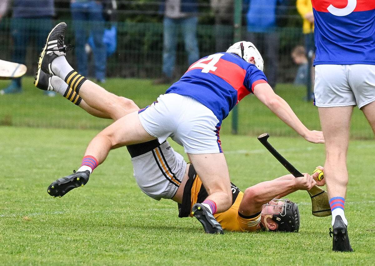 Pa Rourke of Na Piarsaigh and Rian O'Regan of Erins Own go to ground, battling for possession. Picture: David Keane Pa Rourke of Na Piarsaigh and Rian O'Regan of Erins Own go to ground, battling for possession. Picture: David Keane