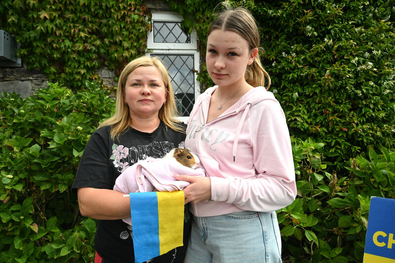  Natalia Husieva and her niece Yana and pet guinea pig.
