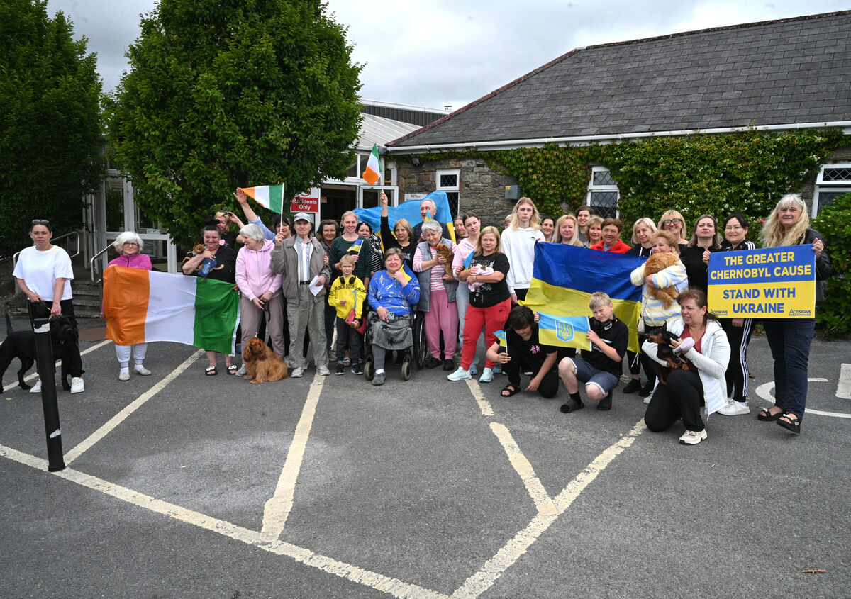 Fiona Corcoran of The Greater Chernobyl Cause with some of the 120 Ukrainians at the Green Glens Arena at Millstreet. Fiona Corcoran of The Greater Chernobyl Cause with some of the 120 Ukrainians at the Green Glens Arena at Millstreet.