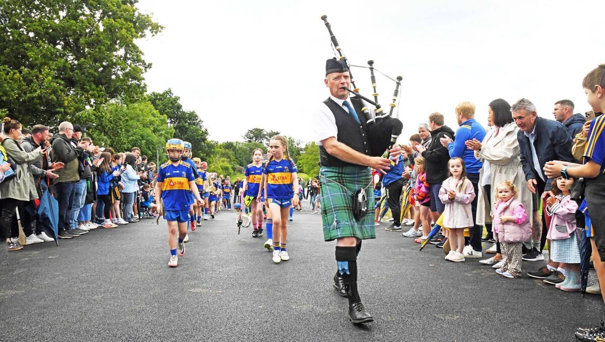 Piper Jason Deasy leading the U9s juvenile players, at the official opening of Carrigaline GAA juvenile pitches, in memory of Billy Walsh. Picture: Siobhán Russell.