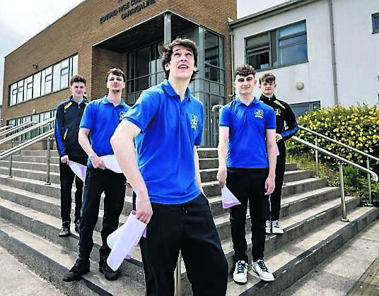 Adam Wynman, Keelan McNamee, Matthew Coakley, Dominic Szabo, and Adrian Coleman mark the end of exam season at Edmund Rice College, Carrigaline, by launching their final Japanese exam paper into the air.