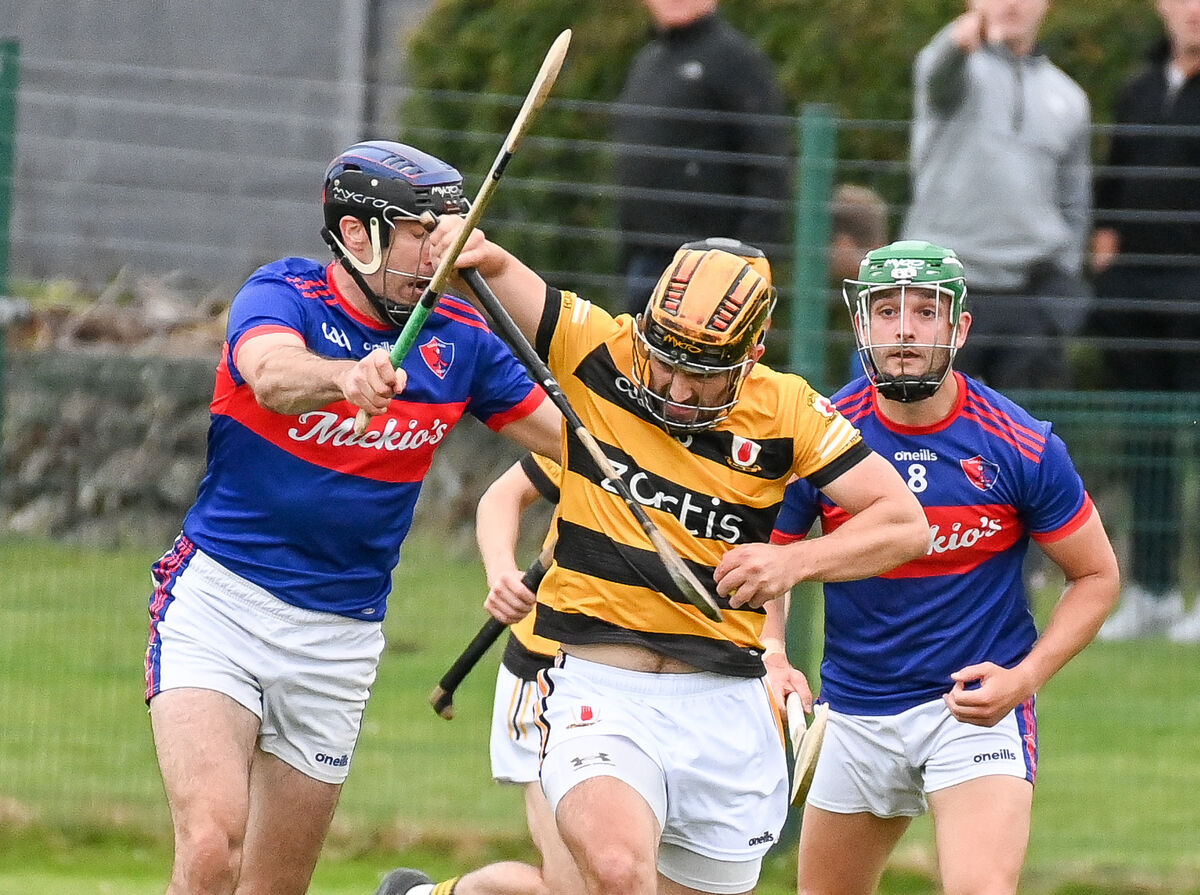 Cian Buckley of Na Piarsaigh battles past Maurice O'Carroll of Erins Own, during their SHL clash at Caherlag.  Cian Buckley of Na Piarsaigh battles past Maurice O'Carroll of Erins Own, during their SHL clash at Caherlag.
