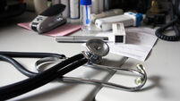 A doctor's desk at a general practitioner's surgery. UK.