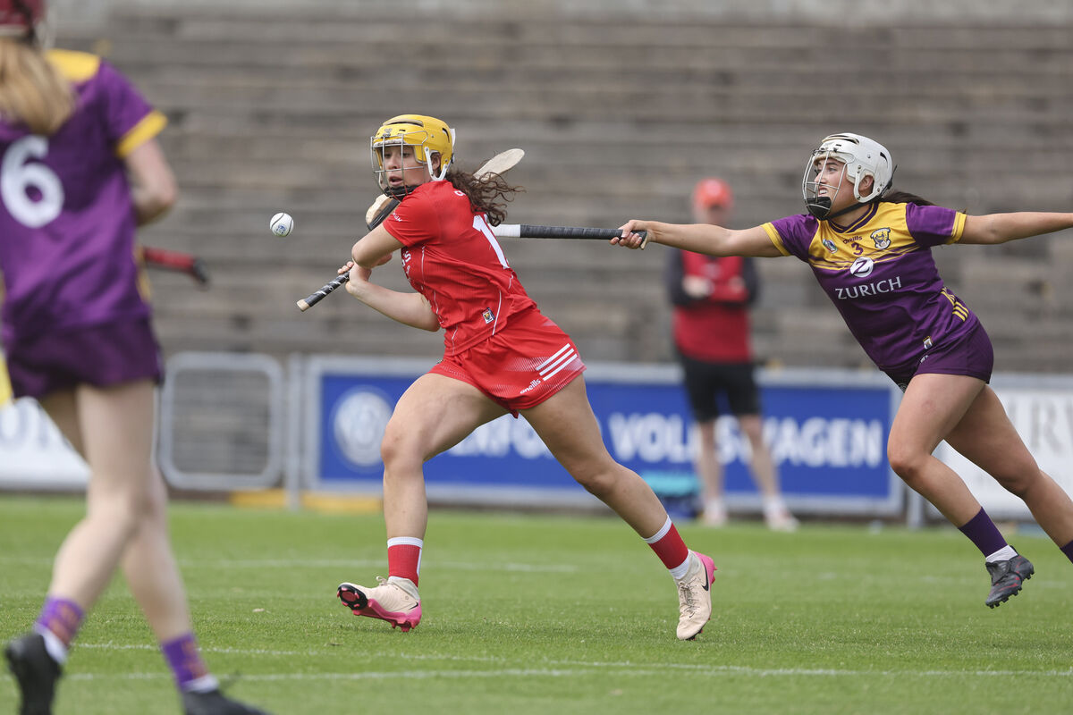 Cork's Clodagh Finn gets a shot away ahead of Wexford's Miria O'Dowd. Photograph: Patrick Browne Cork's Clodagh Finn gets a shot away ahead of Wexford's Miria O'Dowd. Photograph: Patrick Browne