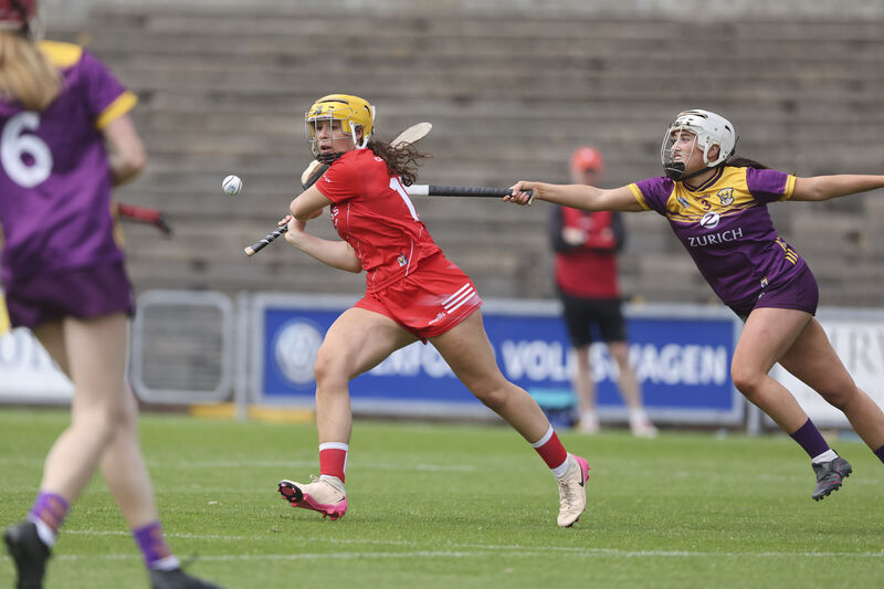 Cork's Clodagh Finn gets a shot away ahead of Wexford's Miria O'Dowd. Photograph: Patrick Browne