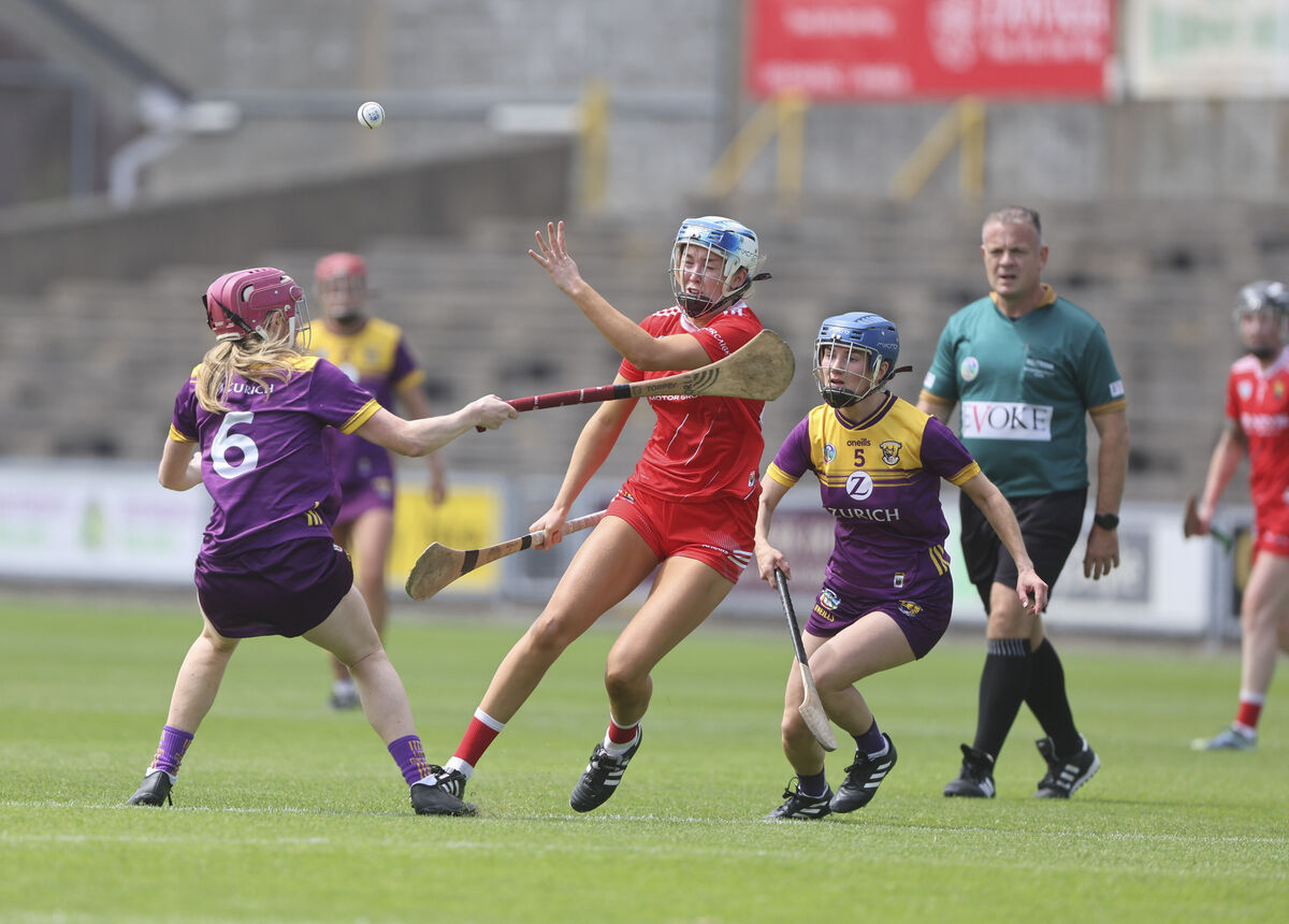 Cork's Orla Mullins gets her pass away under pressure from and Wexford's Orla Sinnott and Clodagh Jackman. Picture: Patrick Browne