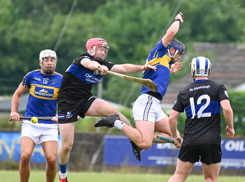 Sarsfields' Daniel Kearney and Carrigtwohill's Liam Gosnell, battle in the air during their SHL clash at Carrigtwohill.