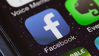 Facebook app icon on mobile phone.