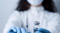 Doctor holding coronavirus vaccine. Covid-19 Vaccination. Stop quarantine. Close-up suringe and medication