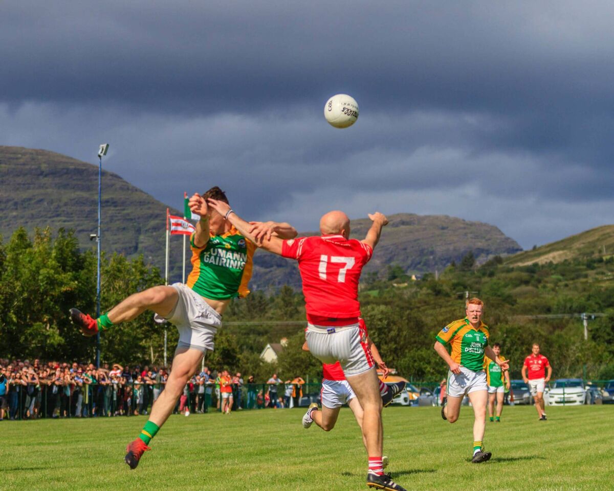 Garnish's Éanna Murphy jumps up for the ball against Urhan. Picture: Anne Marie Cronin Photography