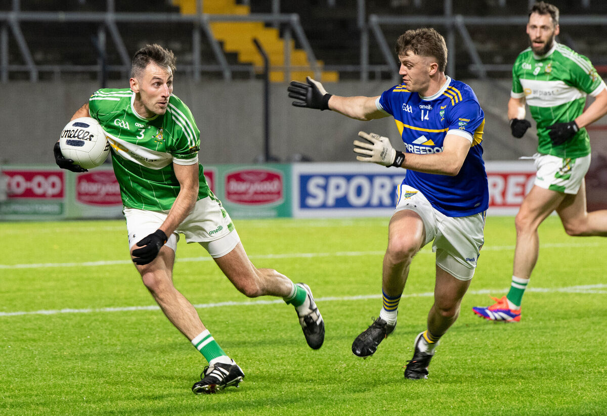 Aghabullogue's Michael Dennehy keeps the ball well away from Kilshannig's Éanna O'Hanlon last season. Picture: Howard Crowdy