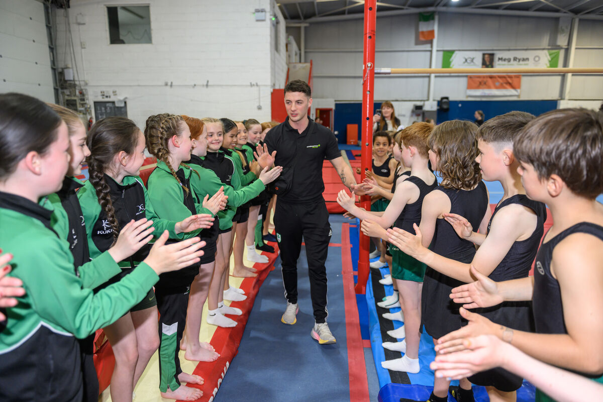 Olympic gold medallist Rhys McClenaghan shares a proud moment with young athletes during his courtesy visit to Douglas Gymnastics Club. Picture Dan Linehan