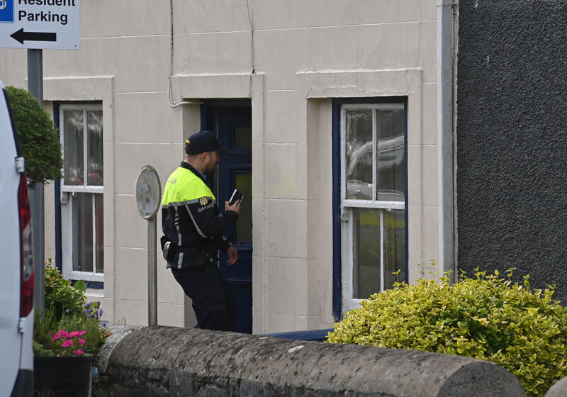  A Garda on duty at the house in Glounthaune Village, Cork where a couple in their 80's were found dead. Picture Dan Linehan