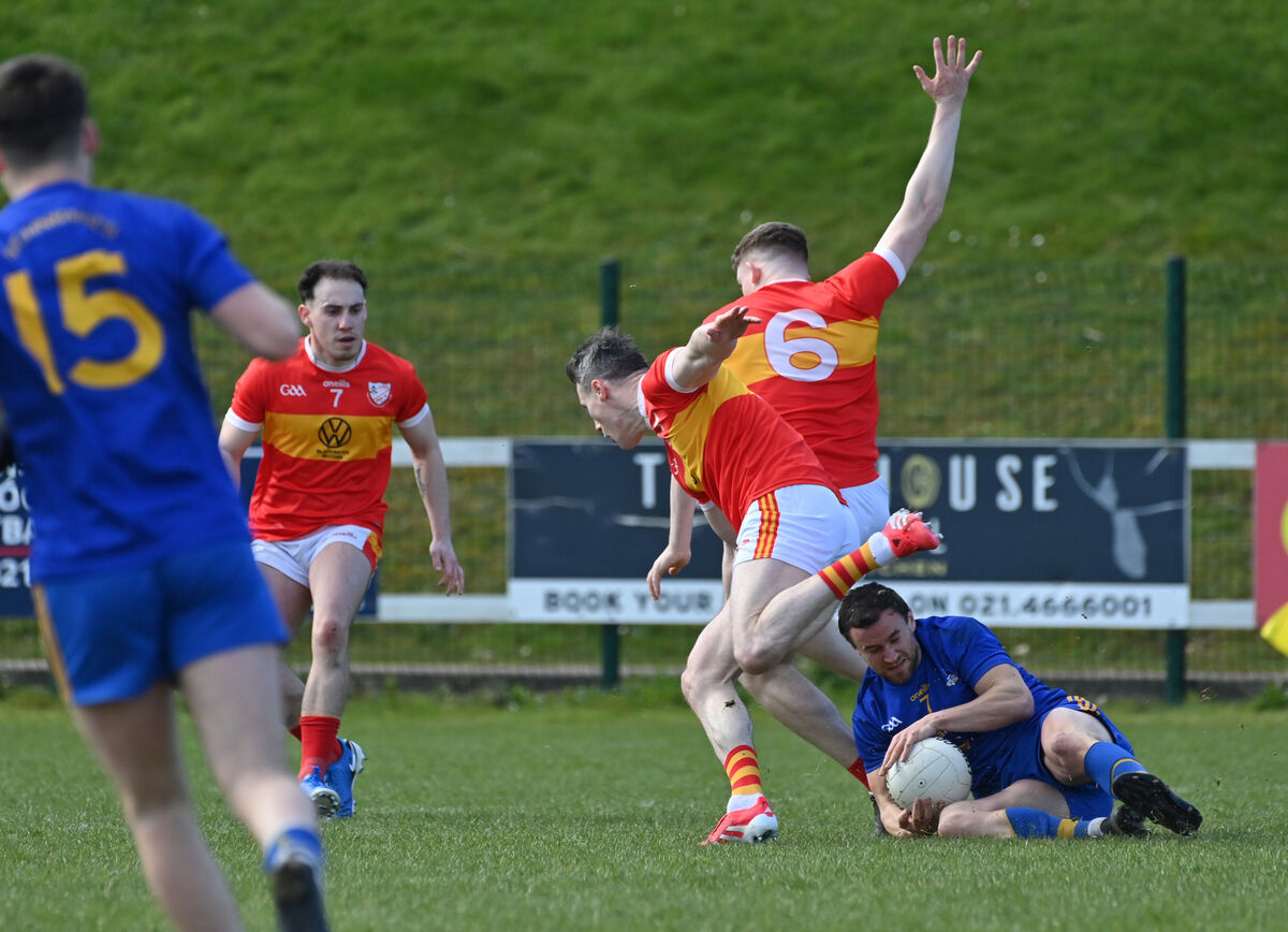 Éire Óg players Hugh Murphy and Mark Griffin clash with Enda Dennehy, St Finbarr’s during the McCarthy Insurance Group football league division 1 match at Ovens. Picture: Dan Linehan Éire Óg players Hugh Murphy and Mark Griffin clash with Enda Dennehy, St Finbarr’s during the McCarthy Insurance Group football league division 1 match at Ovens. Picture: Dan Linehan