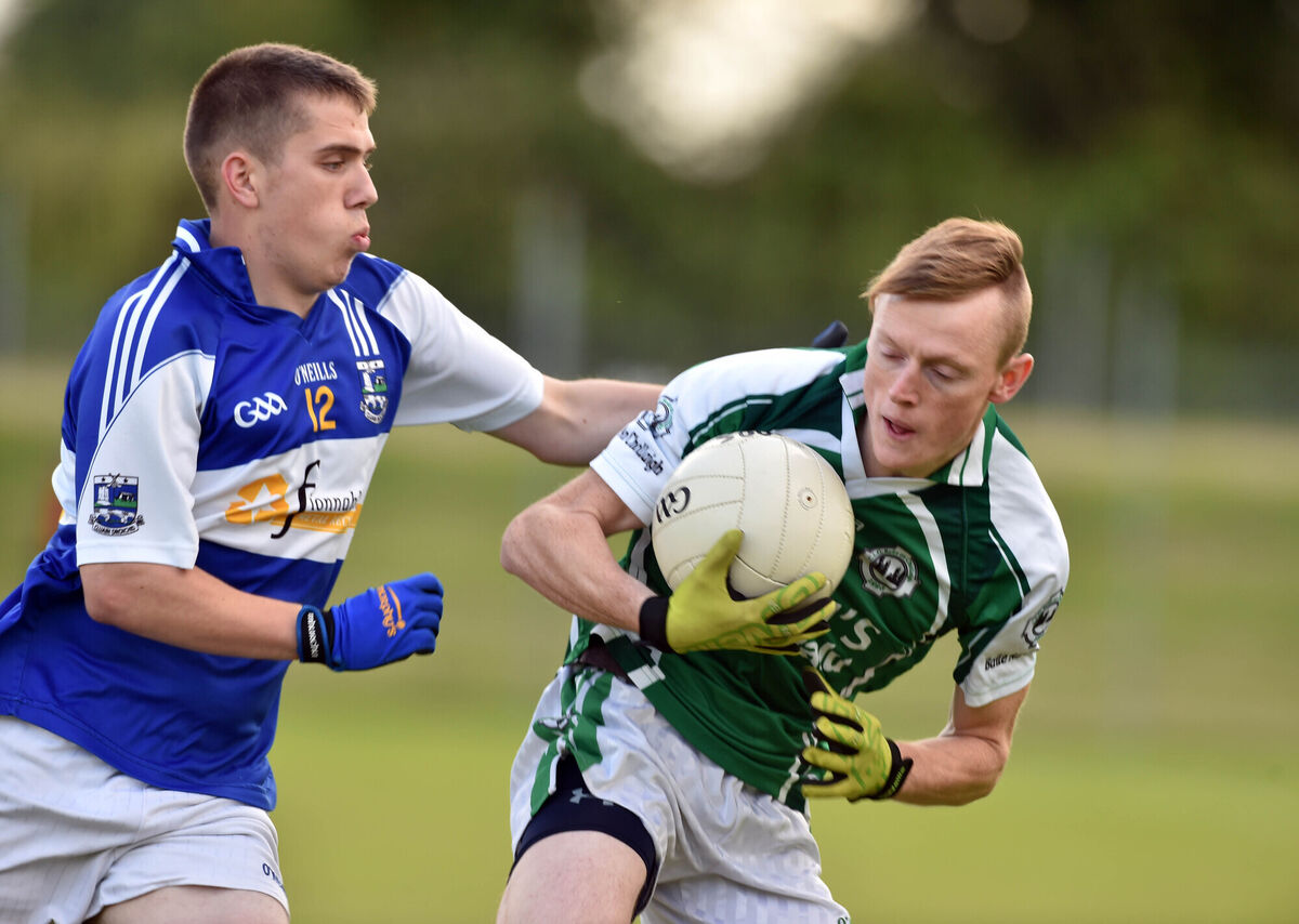 Ballincollig's Chris Collins is tackled by Clondrohid's Darren Dineen. Picture: Eddie O'Hare
