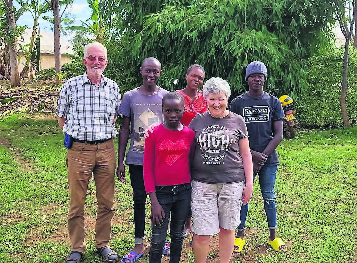 Brendan and Rachel McQuire in Africa with some of the people they are helping through the organisation Development Pamoja. Brendan and Rachel McQuire in Africa with some of the people they are helping through the organisation Development Pamoja.