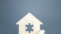Puzzle house with a missing piece. The acquisition or construction comfortable dream home. Mortgage loan purchase real estate. A