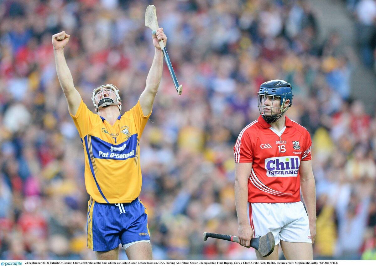 Patrick O'Conno of Clare celebrates at the final whistle of the 2013 All-Ireland SHC final as Cork's Conor Lehane looks on. Picture: Stephen McCarthy/Sportsfile