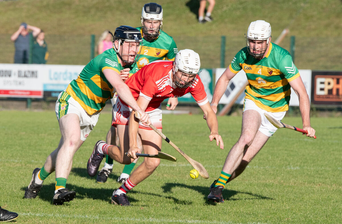 Briain O'Riordain of Uibh Laoire gathers the sliothar ahead of Ballyclough's Denis O'Neill and Connor Duffy. Picture: Howard Crowdy Briain O'Riordain of Uibh Laoire gathers the sliothar ahead of Ballyclough's Denis O'Neill and Connor Duffy. Picture: Howard Crowdy